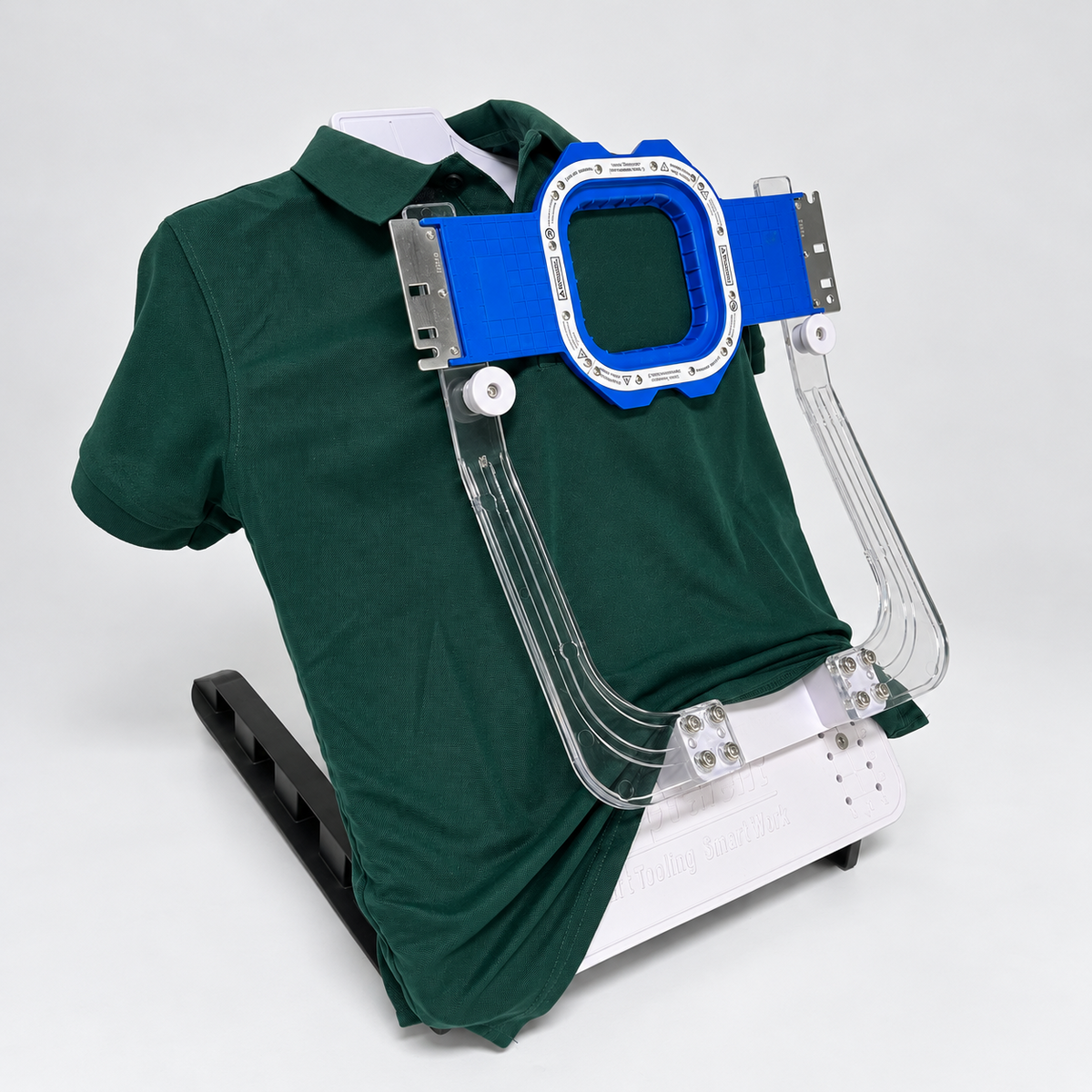 Main hooping station positioning a polo shirt with a magnetic embroidery hoop